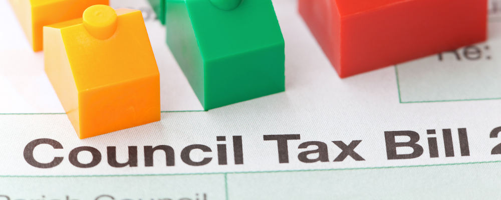 Council tax bill with colourful plastic small houses