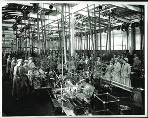 Factory workers at their machines